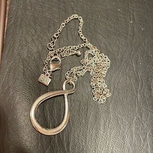 Silver Infinity loop pendant.
